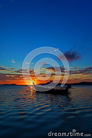 Rawai beach with andaman long tailed boat southern of thailand on clear sea water with sun shine in phuket Stock Photo