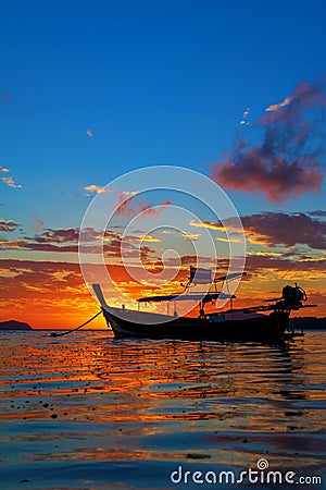 Rawai beach with andaman long tailed boat southern of thailand on clear sea water with sun shine in phuket Stock Photo