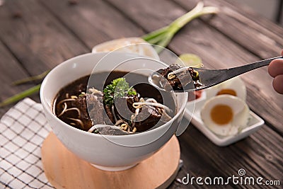 Rawon. traditional Indonesian beef black soup Stock Photo