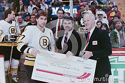 Ray Bourque presented a check from Gordie Howe. Editorial Stock Photo