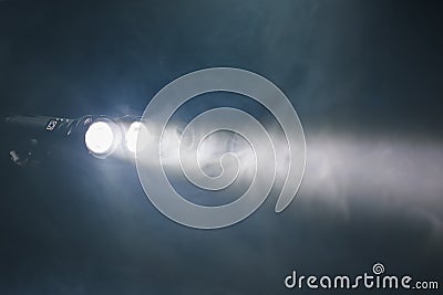 Ray of double pocket flashlight in smoke, copy-space background Stock Photo