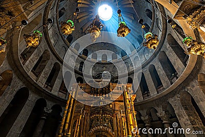 Ray of sunlight breaks through the dome over the tomb of Jesus in the Church of the Holy Sepulcher in Jerusalem, Israel. Editorial Stock Photo