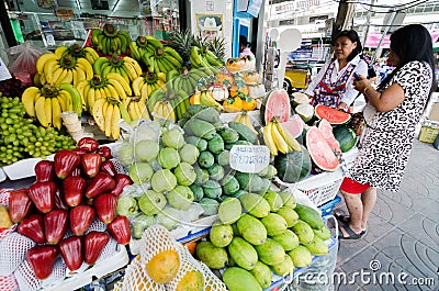 Rayong Sattahip, Thailand : Market women selling fruits. Editorial Stock Photo