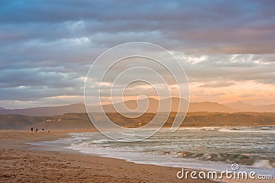 Rays of golden evening light falling on the Plettenberg Bay beach at sunset. Garden Route, Western Stock Photo