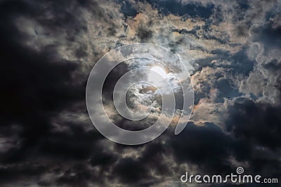 Rays of light shining throug dark clouds Stock Photo