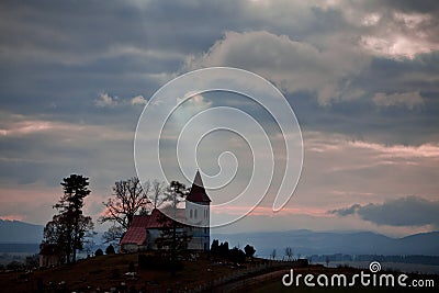 Rays of the sun pointing to Church on the horizon. Stock Photo