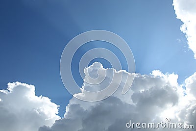 Rays of sunlight over Dutch clouds Stock Photo