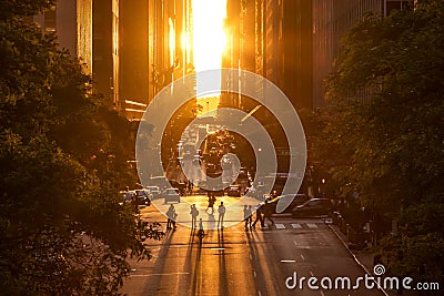 Rays of sunlight shining down on the people and traffic in Midtown Manhattan, New Stock Photo