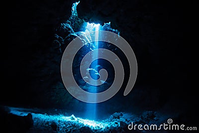 Rays of sunlight into the underwater cave Stock Photo