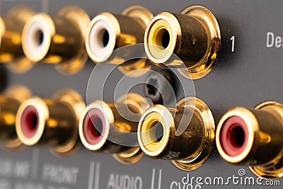 RCA sockets of audio surround receiver amplifier. Macro shot Output audio connectors Stock Photo