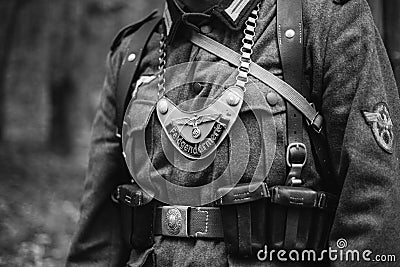 Re-enactor Dressed As World War II German Wehrmacht Military Police Unit - Feldgendarm. Distinctive Gorget Is Visible Stock Photo