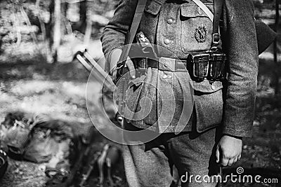 Re-enactor Dressed As World War II German Wehrmacht Soldier Holds Soviet Rifle. Photo In Black And White Colors Stock Photo