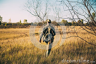 Re-enactor Dressed As World War II Russian Soviet Red Army Officer Soldier Walking Through Autumn Meadow. Soldier Of Stock Photo