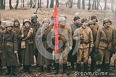 Re-enactors Dressed As Russian Soviet Infantry Soldiers Of World War II Standing In Row. Editorial Stock Photo