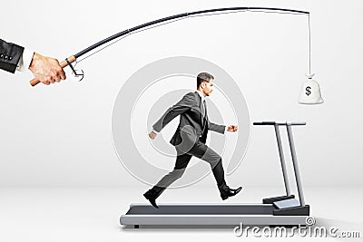 Reach a goal concept with businessman running on a treadmill for Stock Photo