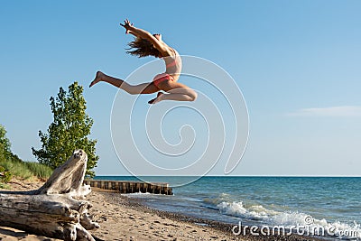 Reach for the Sky and Jump on a Summer Day at Lake Huron Stock Photo