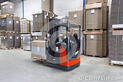 Reach Truck driving Stock Photo