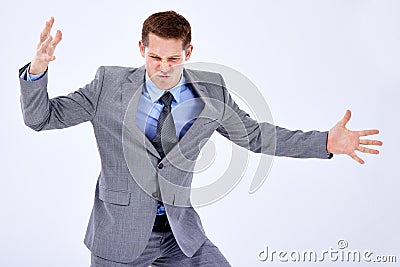 Reaching the end of his tether. Studio shot of a businessman expressing an outburst of anger. Stock Photo