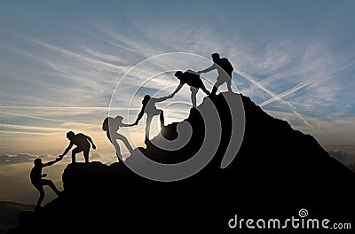 Reaching the Summit - Team Work - Group Effort - Success Stock Photo