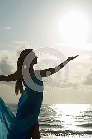 Reaching to catch the sun Stock Photo