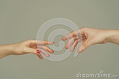 Reaching touching hands. Reach hand. Hopeful concept. Two hands trying to touch. Adam sign. Human relation, togetherness Stock Photo