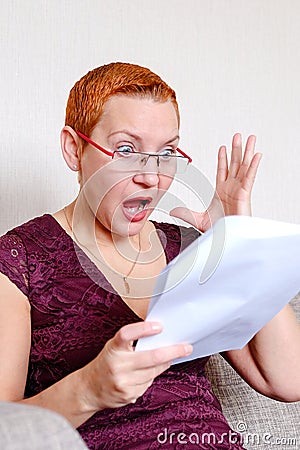 Reaction to errors in the tax report. The emotion of annoyed surprise. She threw her hand up in surprise Stock Photo