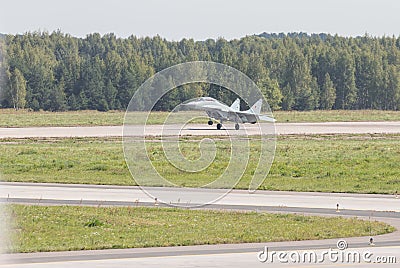 Reactive fighter plane is gaining speed on the runway Stock Photo