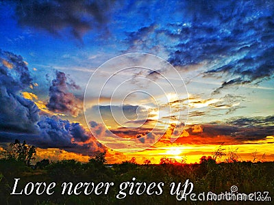 Love never gives up with sunset background Stock Photo