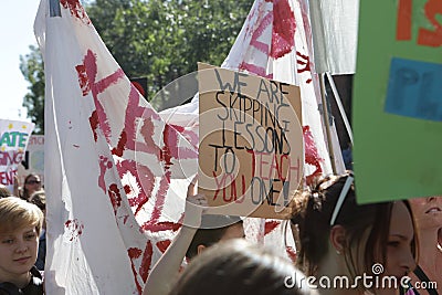 Reading, Berkshire / UK - September 20th 2019: Reading Climate Strike. School aged girl holds protest sign saying `We are skipping Editorial Stock Photo