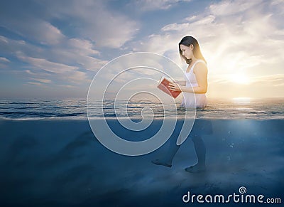 Reading the Bible in deep waters Stock Photo