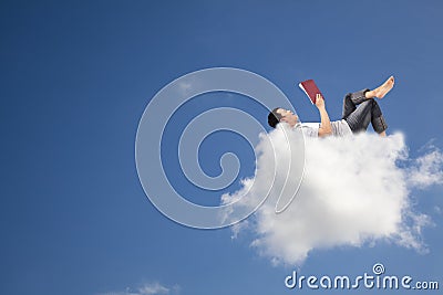 Reading book on the cloud Stock Photo