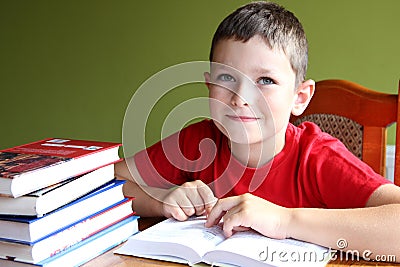 Reading book and doing homework Stock Photo
