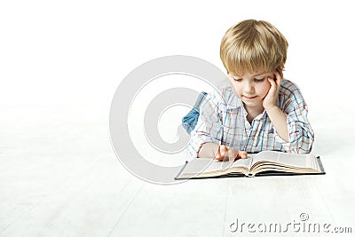 Kid Reading Book, Little Child Boy Read in School, lying down white floor Stock Photo