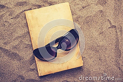 Reading favourite old book on summer vacation beach holiday Stock Photo