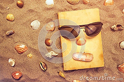 Reading favourite old book on summer vacation beach holiday Stock Photo