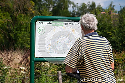 Reading the nodes map by biker Stock Photo