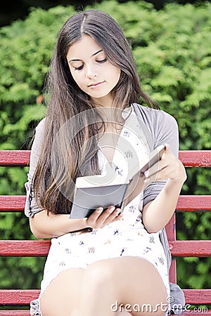 Reading outdoors Stock Photo
