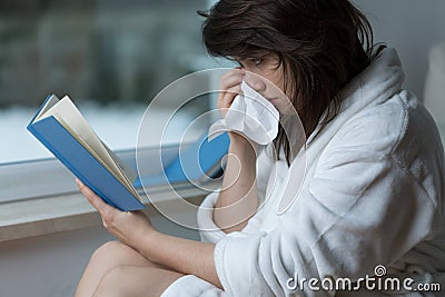 Reading the romance and crying Stock Photo