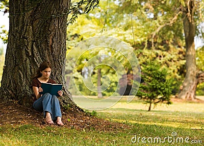 Reading in the Shade Stock Photo