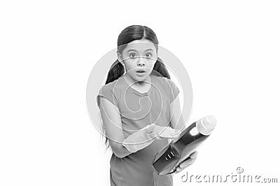 Reading washing instruction for using household cleaning product. Small child holding laundry detergent. Cute cleaner Stock Photo