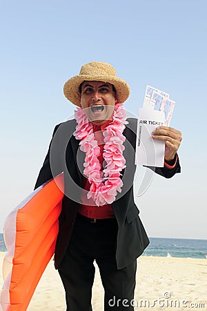 Ready for a holiday: businessman on the beach Stock Photo