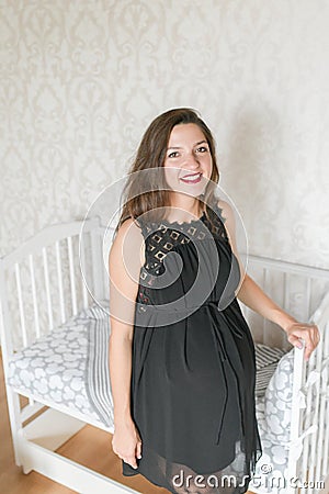 Ready room for the unborn child. girl is ready to bring the child to the room Stock Photo