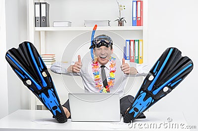 Ready for vacation. Cheerful businessman in flippers and snorke Stock Photo