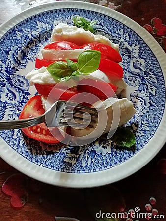 Real tricolore Caprese salad in Italy with real buffala mozzarella Stock Photo