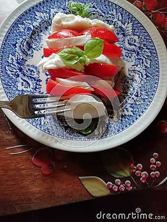 Real tricolore Caprese salad in Italy with real buffula mozzarella Stock Photo