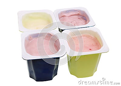 Real cheap nonfat cherry and strawberry yogurt in blue and green open plastic cups isolated macro Stock Photo