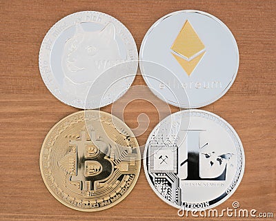 Real coins of ryptocurrency Bitcoin Ethereum Dogecoin and Litecoin Editorial Stock Photo