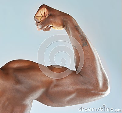 Real effort Real results. a man flexing his muscles. Stock Photo