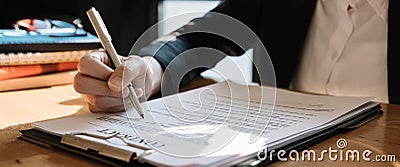 Real estate agent sign a contract documents agreement with customer to sign contract Stock Photo