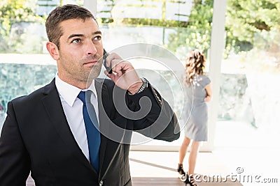 Real-estate agent talking on the mobile phone Stock Photo